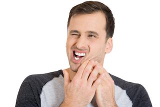 A man holds his jaw in pain | Dental Emergency Hartford CT